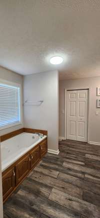 Primary Bath with Double Sink Vanity, 2 Custom Walk-In Closets, Separate Shower and Custom Jetted Tub
