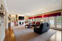 Living are with fireplace and beautiful built in book shelves