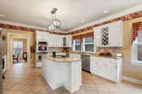 Double walk in pantries tucked away between kitchen and dining area