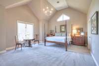 Primary Bedroom with lofted ceilings and French doors