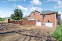 Spacious parking and a 4 car garage for vehicles.