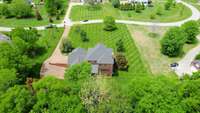 2145 Summer Hill Circle! A home w/ sand & finished hardwood floors & tile, owner's suite on main level- A custom kitchen upstairs & downstairs-Tons of storage, neighborhood near Berry Farms-Private back yard w/ double screened-in porches.