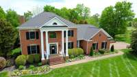 2145 Summer Hill Cir in Franklin, this beauty sits on over an acre & offers an in-law suite with walk-out screened-in porch, garage entry. Home has been redecorated,custom kitchen along with so much more! Wonderful neighborhood near Berry Farms!