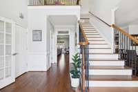 Wainscoting, Crown Molding, Sand and Finish Flooring all Greet you in this spacious Foyer!