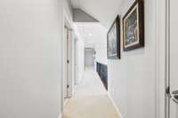 Hallway upstairs leading to 3 bedrooms and 2 bathrooms.