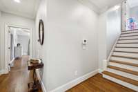 Back stairs to Bonus off of kitchen near garage door.