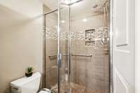 A walk-in shower that's tiled.