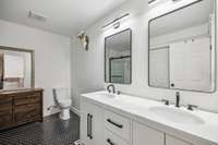 Renovated Primary Ensuite Bathroom with Dual Vanity, Tile Flooring & Tile Shower with Glass Door