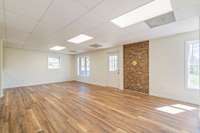 You can attach a stove in front of the brick wall or hang a picture there for decoration.