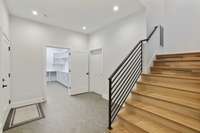 Lower floor with extra storage and laundry room. 3 car garage with EV 220 car charger