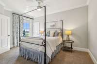 Guest bedroom with walk-in closet and private access to a Jack and Jill bathroom. Large window brings in plenty of natural light, creating a bright and welcoming space for guests.