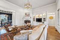 Centrally located on the main floor, the living room connects seamlessly to the formal dining room, front entry, and primary suite. Its layout anchors the home with comfort, flow, and natural light.