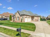 The side-entry three-car garage and wide driveway offer plenty of parking and add to the home's clean, upscale curb appeal.