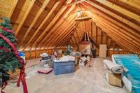 Expansive attic space accessible from the upstairs bonus room offers tons of extra storage. Perfect for holiday decor, seasonal items, or anything you want tucked out of the way but still easy to reach.
