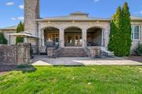 This covered back patio is made for entertaining with its beautiful brick arches, stamped concrete, and separate grilling area. Plenty of room to relax or host guests while enjoying the privacy of the fully fenced yard.
