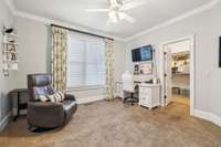 This bedroom, currently set up as an office, has a large walk-in closet and private access to the Jack and Jill bathroom. It overlooks the backyard and gets great natural light.