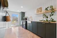 Mud room/ drop zone just off the 3 car garage with custom cabinets and loads of storage