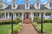 Such great curb appeal and you are greeted with a red front door and two side lights welcoming you to stay and sit awhile.
