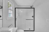 Closer look at the new shower & doors.  This shower has NEVER been used since the remodel occurred.