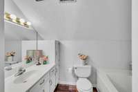 The upstairs bathroom has been remodeled.  You have new flooring like the other wet areas of the home and fresh paint.  There is a linen closet in the hallway along with additional  vanity storage.
