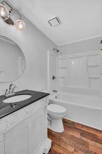 Main floor guest bath has been remodeled - new shower/tub, faucets, toilet, lighting, mirror, vanity, flooring and fresh paint.