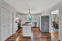 Remodeled kitchen is ready for the chef of the family.  New stainless steel appliances and the stove & dishwasher have NEVER been used. Pantry is to the left.