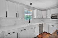 Sooo much countertop space and cabinets will make this kitchen the hub of the house and the go to home for the holidays.  A white kitchen is so clean and fresh looking plus it gives you a great foundation to add your own personality and colors.