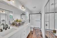 The primary bathroom has been remodeled from top to bottom.  New large shower with glass shower doors, raised double vanity, toilet, faucets, lighting, LVP flooring and fresh paint.