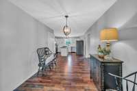 This view of the kitchen, is near the french doors leading out to the sunroom.  This is such a big space.