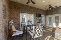Covered patio with TV and fans