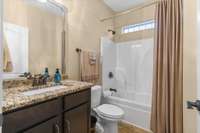 Full bath off downstairs hallway