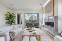 European finishes and cozy fireplace. Living room walks out into private balcony
