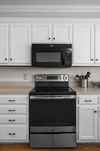 Abundant cabinets and stainless appliances.