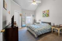 Primary bedroom/suite with cathedral ceiling and walk-in closet.