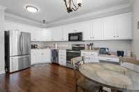 Large eat-in kitchen w/planning desk & double window for great natural light.