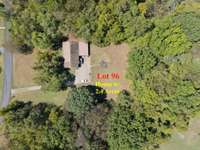 Lot 96 has a house and a 2 bedroom septic in place as well as water and electricity run to it