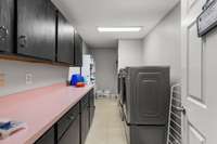 Hughe utility room, ample storage, folding tables etc.
