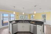 Super sized kitchen with everything you could need, over looking the lake, eat-in and see the storage / utility room for kitchen.