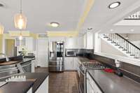 Super sized kitchen with everything you could need, over looking the lake, eat-in and see the storage / utility room for kitchen.