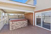 View of the deck & jacuzzi overlooking the lake
