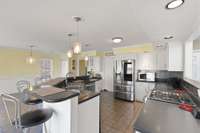 Super sized kitchen with everything you could need, over looking the lake, eat-in and see the storage / utility room for kitchen.