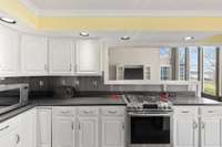 Super sized kitchen with everything you could need, over looking the lake, eat-in and see the storage / utility room for kitchen.