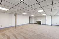 Look at this massive lower level play / Bonus room, Media Center, Man Cave or more overlooking the Lake