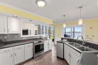 Super sized kitchen with everything you could need, over looking the lake, eat-in and see the storage / utility room for kitchen.