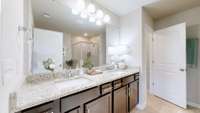 Double vanity with beautiful counter tops with plenty of space for all to get ready for the day.
