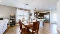Large enough dining room space for large dining room table and bar stools.