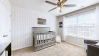 The first of 3 upstairs bedrooms. Large windows provide ample amount of natural light.