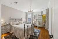 third bedroom upstairs with Juliet balcony opens to the mural room