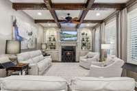 den with gas fireplace and built ins