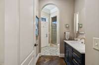 full bath with door to outside and walkway to pool